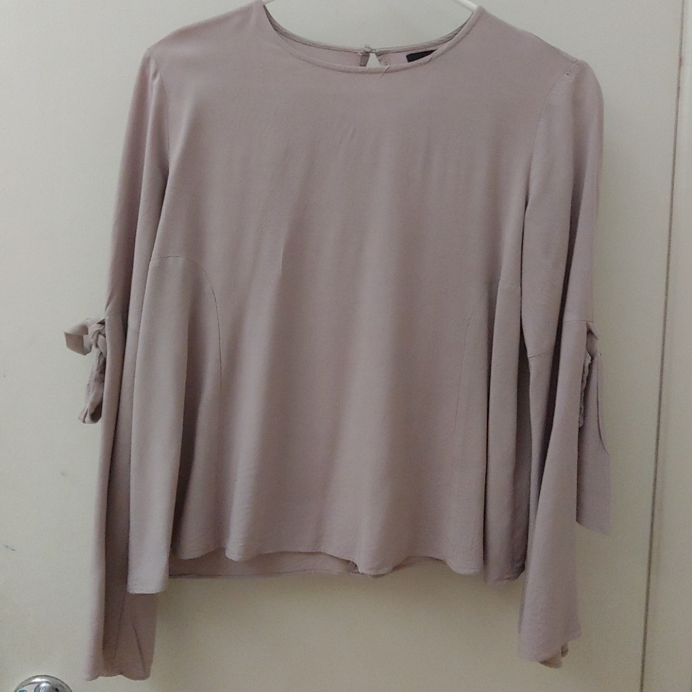 Beautiful blouse with ribbons on sleeves